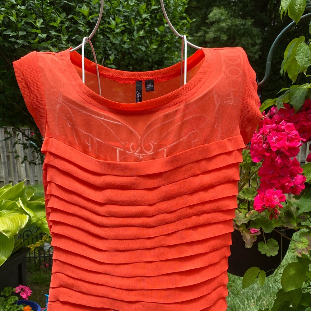Coral layered blouse with ruffle sleeves